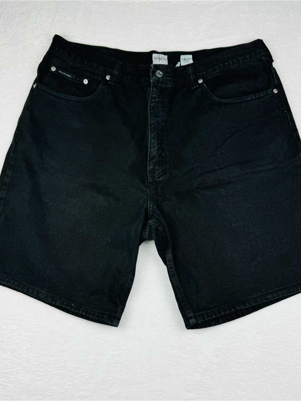 Calvin Klein black denim shorts. Men’s size 38.